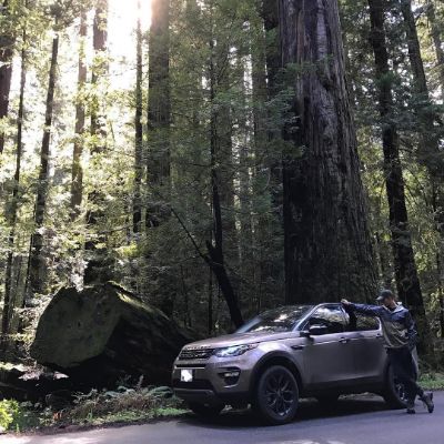 Photo of Travis Van Winkle along with his Land Rover Discovery Sport HSE LUX. 